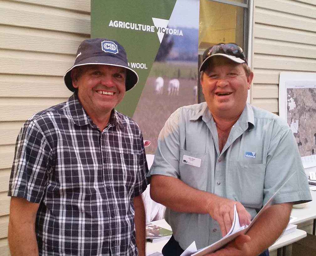From left, landholder David Wells discusses fire recovery with Neil James from Agriculture Victoria at a community get together at Scotsburn Hall organised by the Upper Williamson’s Creek Landcare Group on Christmas eve 2015.
