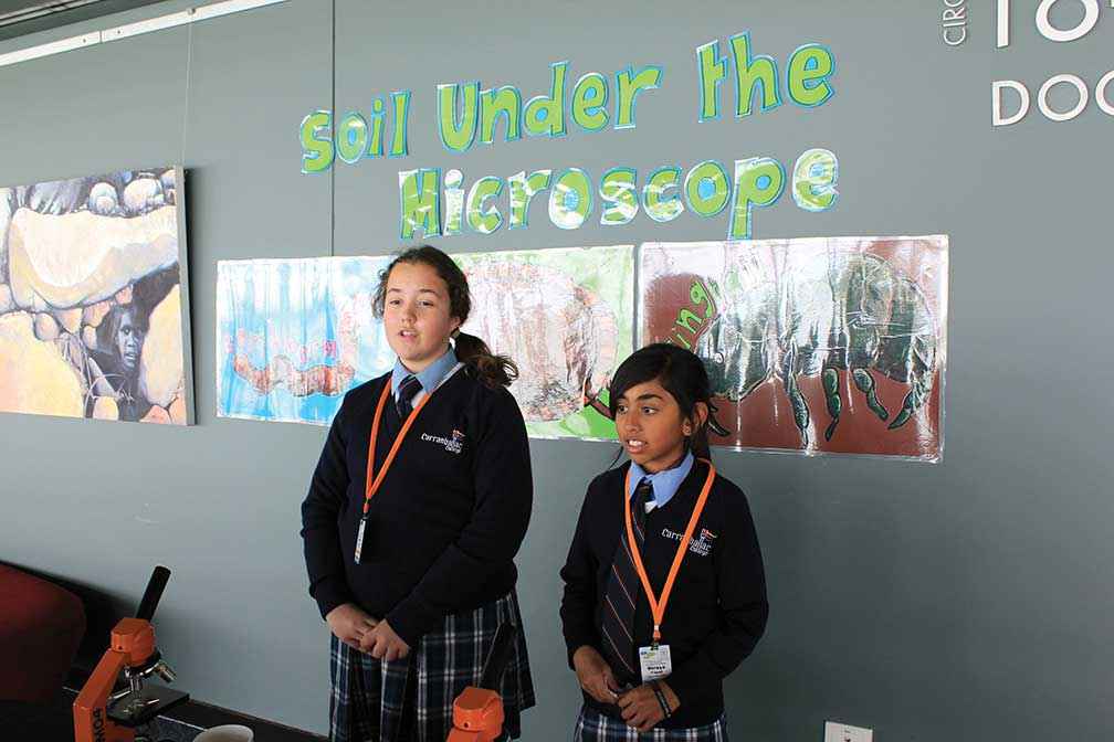 Olivia Margeta (left) and Radhe Parasram from Carranballac College presenting their science workshop on measuring pH in the soil at a Kids Teaching Kids Conference in Western Australia.