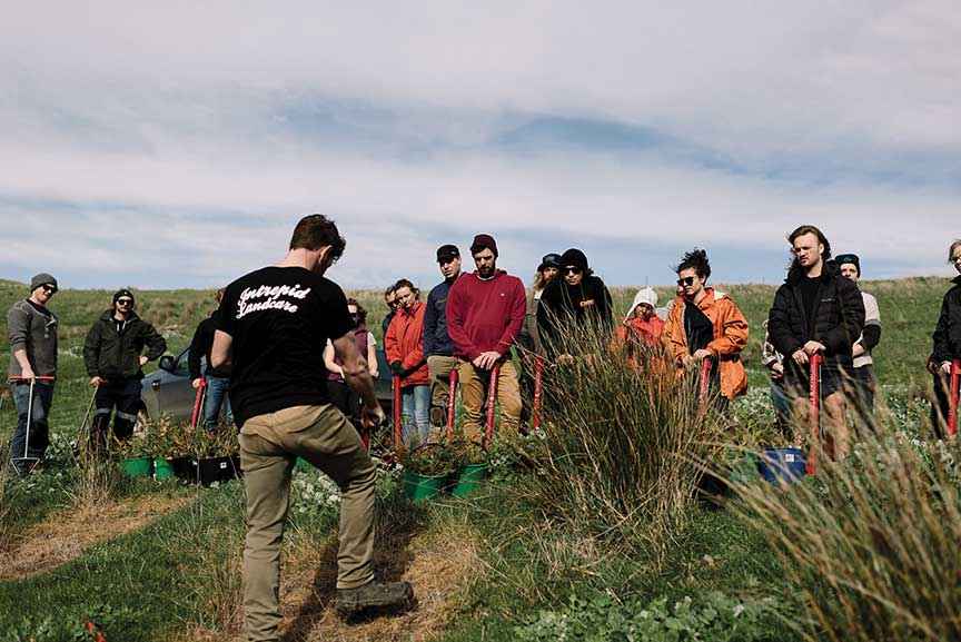 Young volunteers preparing to revegetate steep country at a plant and dance event at Cape Woolamai where 3000 native trees were established.