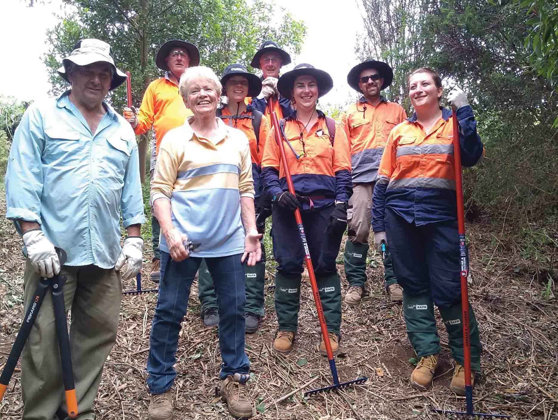 The South East Environmental Work Crew with landholders Richard Price and Marijke de Bever-Price on their Jindivick property.