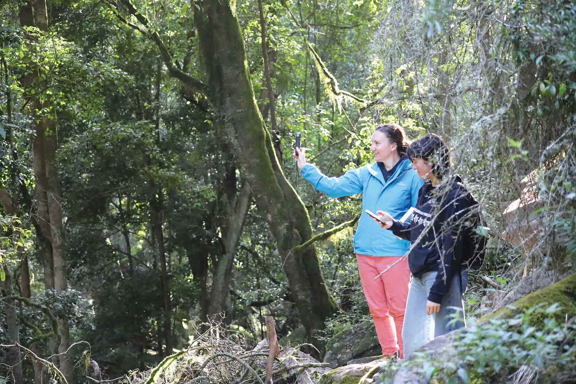 Using mobiles in the field at the Den of Nargun on Brayakaulung Country.
