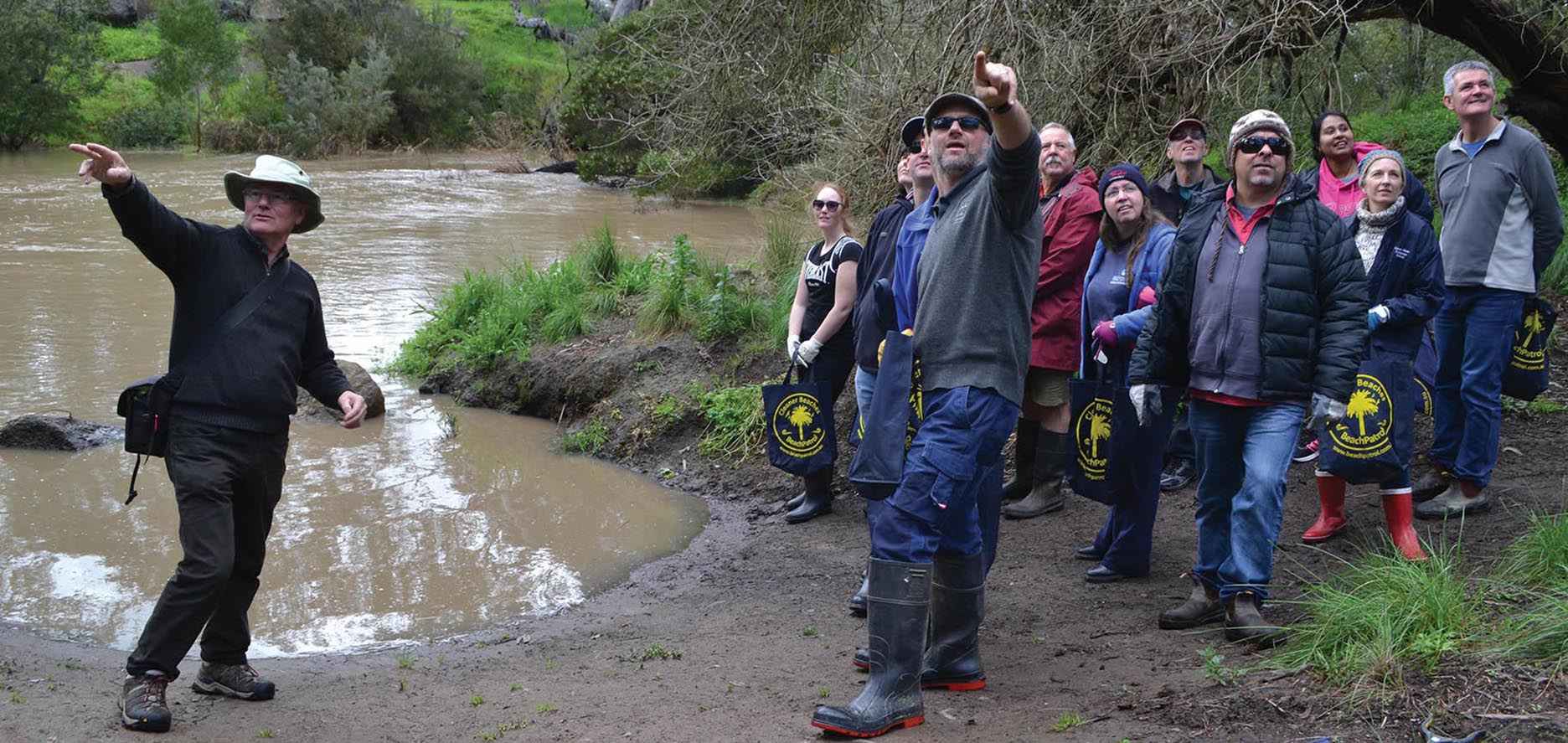 Riverkeeper John Forrester (at left) leads a group of staff from Good News Lutheran College on a walk at Cobbledicks Ford Reserve, Mount Cottrell, in the City of Wyndham.