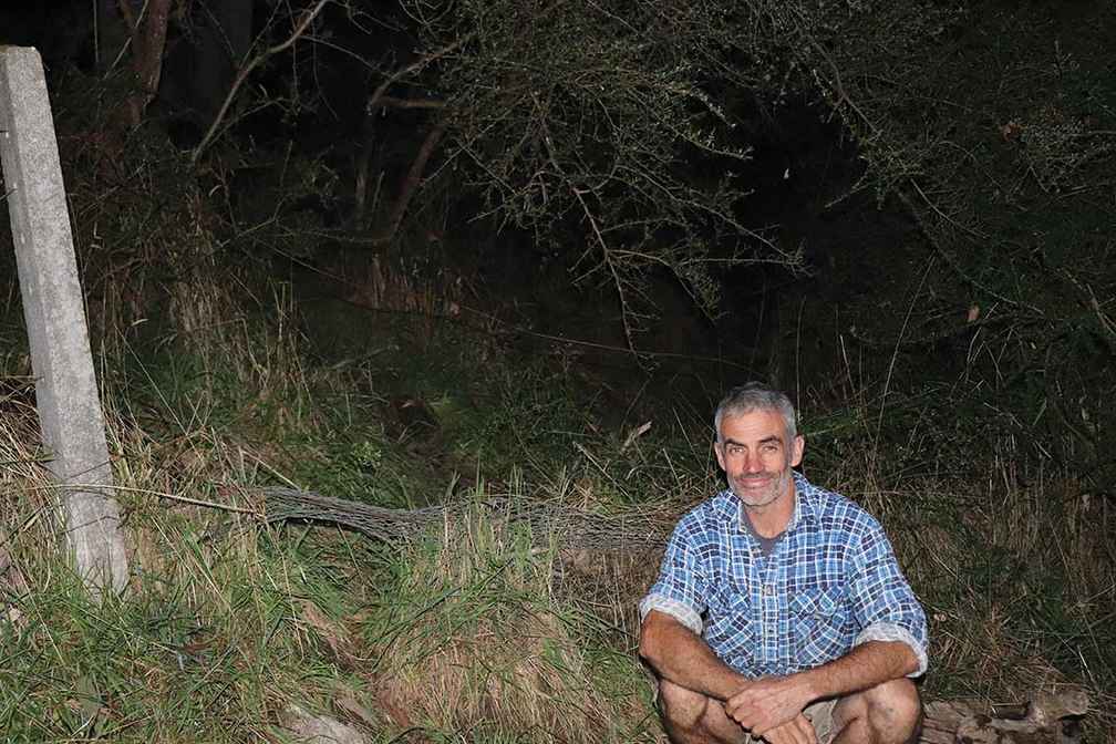 Landholder Ben Teek from Tallangatta South next to a fence on his property that has been damaged by deer.
