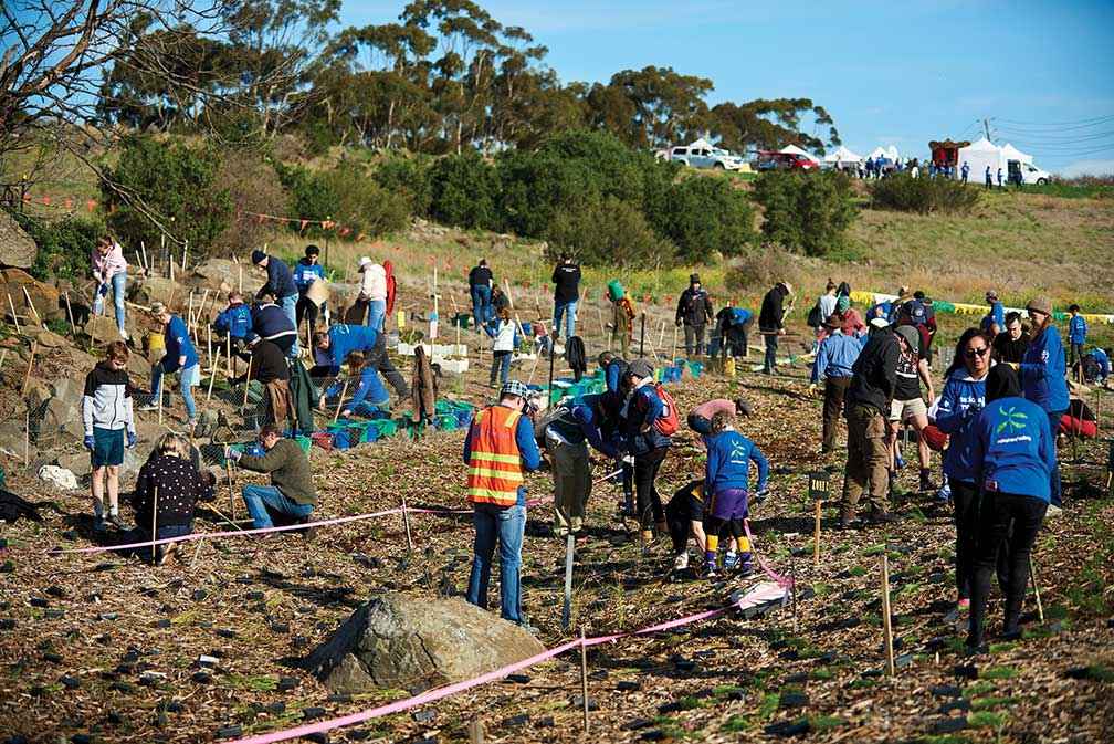 Friends of Lower Kororoit Creek at a National Tree Day planting event in 2019 marking the opening of a new community parkland as part of the Greater Melbourne Cemeteries Trust project to make memorial parks more welcoming.