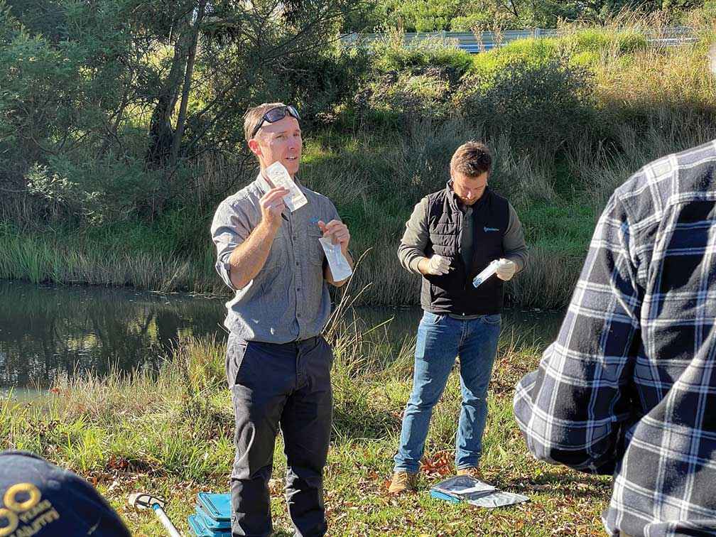From left, ecologist Josh Griffiths instructs MCLG volunteers on how to take eDNA water samples, assisted by Dr Farley Connelly. 