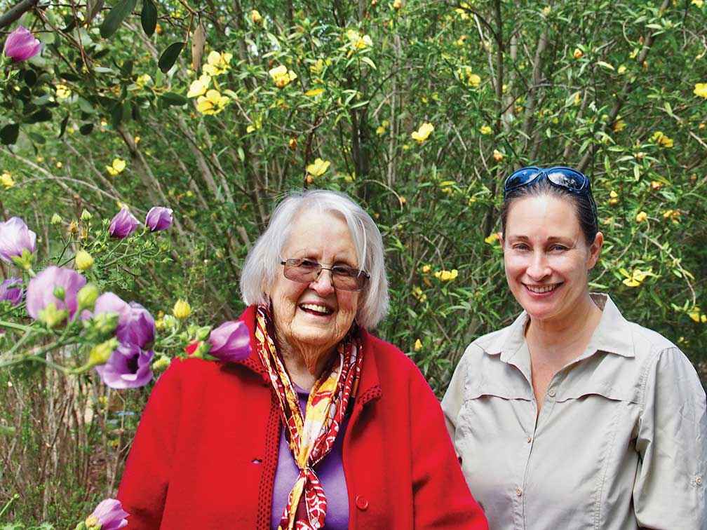 Dr Beth Gott in the Aboriginal Garden at Monash University with Tess Holderness, who is researching Beth’s life and work.