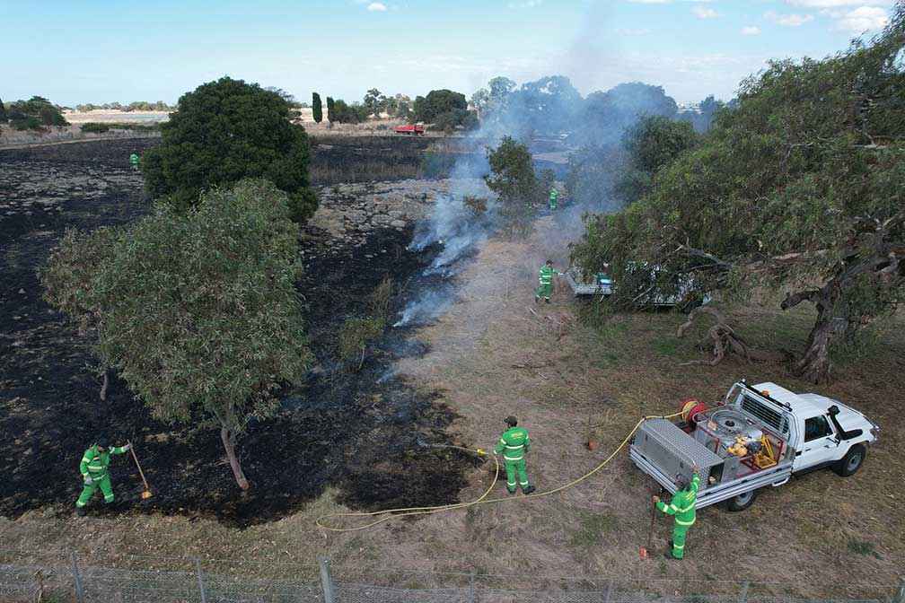 Narrap Unit Rangers manage the cool fire cultural burn at Wollert Community Farm in April 2023.